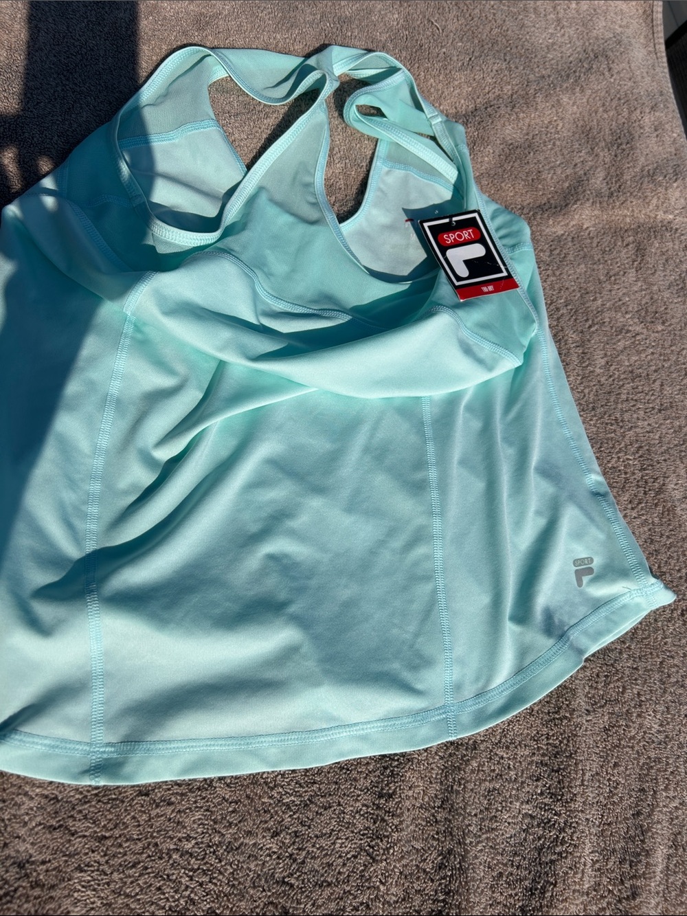 Women's size medium. NWT Fila Light Aqua Performance Racerback Tank